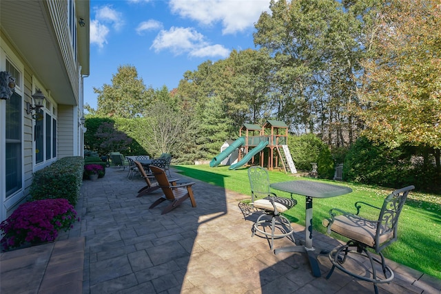 35 Monterrey Dr, Saint James, NY 11780 - view of patio featuring a playground and view of wooded area