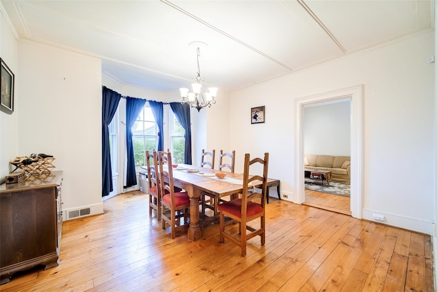 12 Beechwood Ter, Poughkeepsie, NY 12601 - dining area featuring a chandelier, light wood-style flooring, and ornamental molding