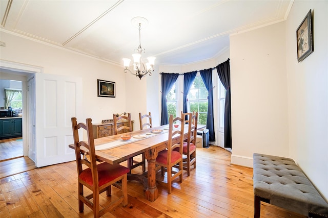 12 Beechwood Ter, Poughkeepsie, NY 12601 - dining space featuring light wood-type flooring, plenty of natural light, a chandelier, and ornamental molding