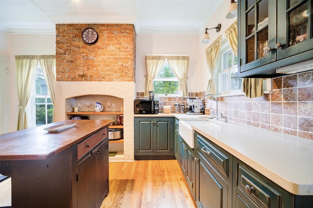 12 Beechwood Ter, Poughkeepsie, NY 12601 - kitchen with black microwave, light wood-type flooring, ornamental molding, tasteful backsplash, and butcher block counters
