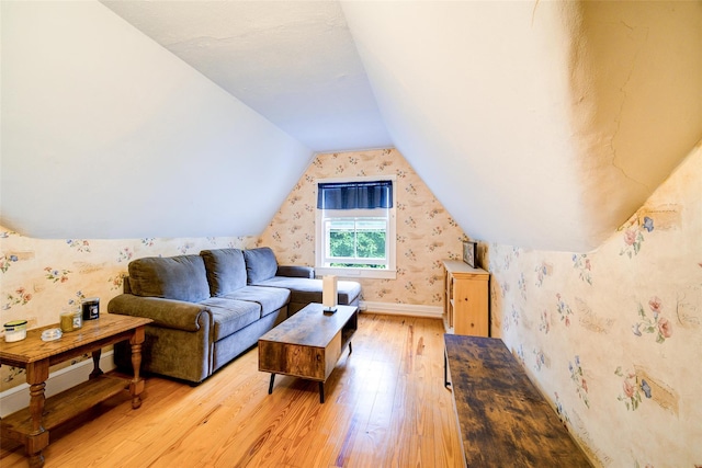 12 Beechwood Ter, Poughkeepsie, NY 12601 - living room featuring light wood-style flooring, wallpapered walls, and vaulted ceiling