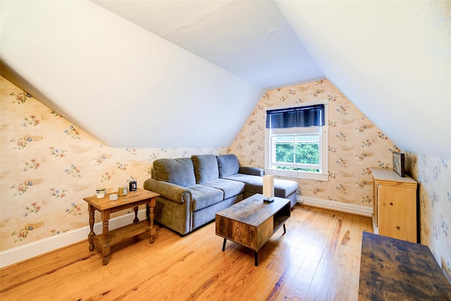 12 Beechwood Ter, Poughkeepsie, NY 12601 - living room featuring light wood-style floors, wallpapered walls, and vaulted ceiling