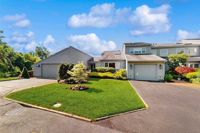 1 Harbour Unit 1, Blue Point, NY 11715 - view of front of house featuring a garage, asphalt driveway, and a front lawn