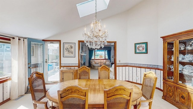 1 Harbour Unit 1, Blue Point, NY 11715 - dining space with a chandelier, a skylight, high vaulted ceiling, and light carpet