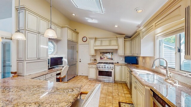 1 Harbour Unit 1, Blue Point, NY 11715 - kitchen featuring cream cabinetry, premium appliances, custom exhaust hood, light stone counters, and lofted ceiling