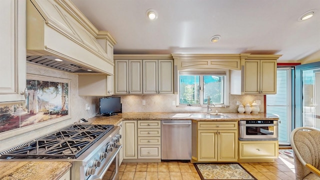 1 Harbour Unit 1, Blue Point, NY 11715 - kitchen with appliances with stainless steel finishes, cream cabinets, custom range hood, tasteful backsplash, and recessed lighting