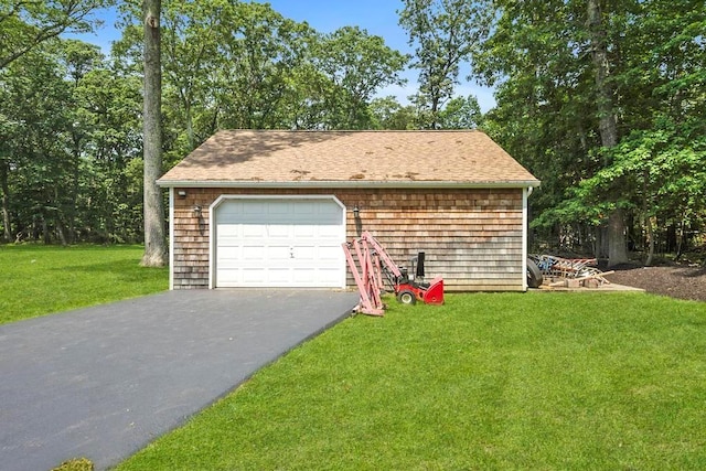 15 Stillwood Rd, Brookhaven, NY 11719 - detached garage featuring asphalt driveway