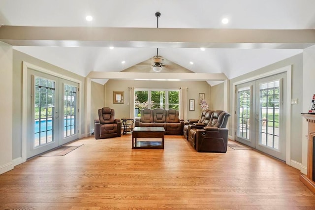 15 Stillwood Rd, Brookhaven, NY 11719 - living room featuring french doors, light wood-style floors, lofted ceiling, and ceiling fan