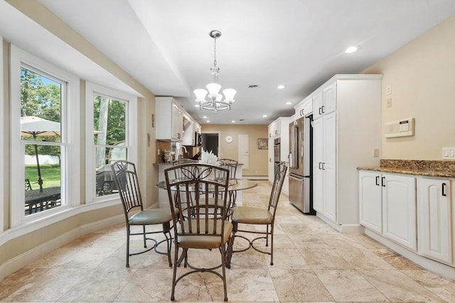 15 Stillwood Rd, Brookhaven, NY 11719 - dining area featuring a chandelier, recessed lighting, light stone finish floors, and baseboard heating