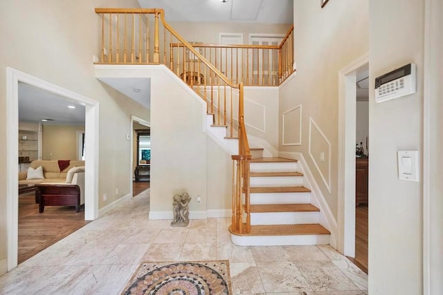 15 Stillwood Rd, Brookhaven, NY 11719 - staircase featuring a towering ceiling