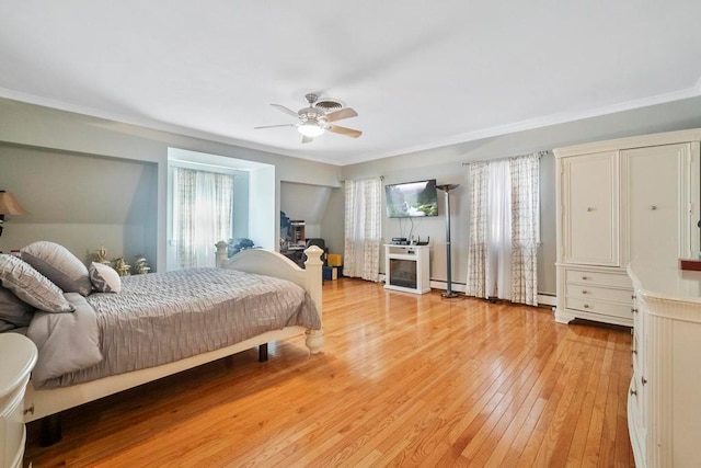 15 Stillwood Rd, Brookhaven, NY 11719 - bedroom with a baseboard radiator, light wood-style floors, a baseboard heating unit, crown molding, and ceiling fan