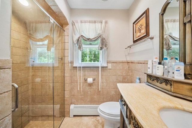 15 Stillwood Rd, Brookhaven, NY 11719 - full bath with a baseboard radiator, tile walls, a stall shower, vanity, and a wainscoted wall