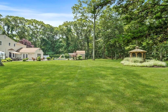 15 Stillwood Rd, Brookhaven, NY 11719 - view of grassy yard featuring a gazebo and an outbuilding