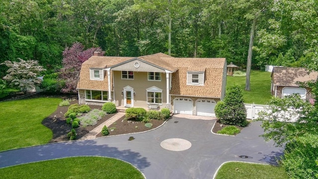 15 Stillwood Rd, Brookhaven, NY 11719 - view of front of property featuring asphalt driveway, an attached garage, a gambrel roof, and a chimney