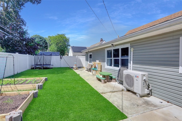 206 Friends Ln, Westbury, NY 11590 - fenced backyard featuring a vegetable garden, a patio, and a trampoline