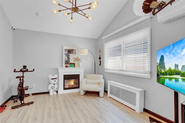 206 Friends Ln, Westbury, NY 11590 - living area featuring radiator, a wall unit AC, wood finished floors, vaulted ceiling, and a glass covered fireplace