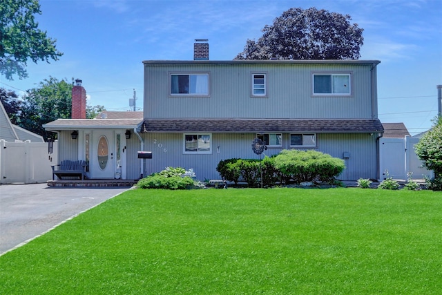 206 Friends Ln, Westbury, NY 11590 - view of front of home featuring a chimney, a porch, and a shingled roof