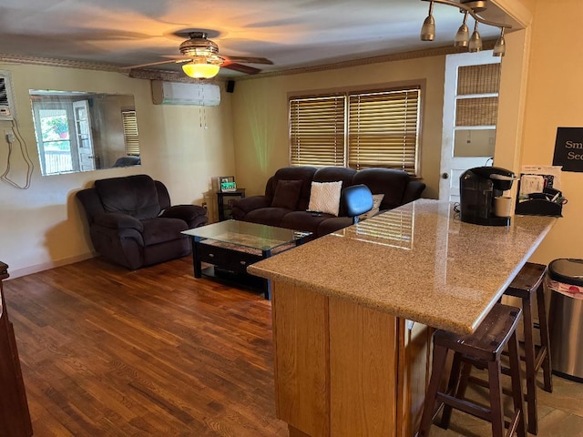 944 Annette Dr, Wantagh, NY 11793 - living area with a ceiling fan, wood finished floors, a wall mounted air conditioner, and ornamental molding