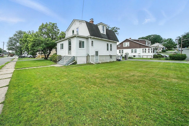 20 Columbia Ave, Middletown, NY 10940 - back of house featuring a lawn, a chimney, and roof with shingles
