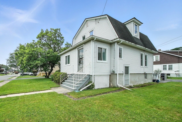 20 Columbia Ave, Middletown, NY 10940 - view of side of property with a lawn and roof with shingles