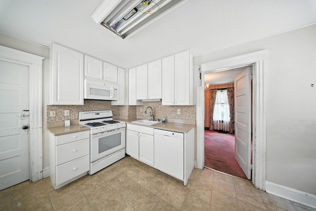 20 Columbia Ave, Middletown, NY 10940 - kitchen with white appliances, light countertops, white cabinets, and tasteful backsplash