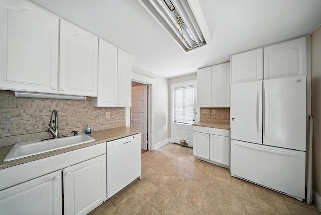 20 Columbia Ave, Middletown, NY 10940 - kitchen featuring white appliances, backsplash, white cabinetry, and light countertops