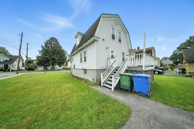 20 Columbia Ave, Middletown, NY 10940 - view of property exterior featuring a lawn and a gambrel roof