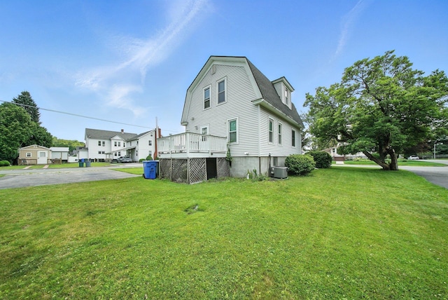 20 Columbia Ave, Middletown, NY 10940 - view of property exterior featuring a yard, a gambrel roof, and a deck