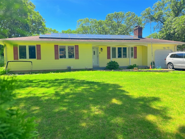 190 Springdale Dr, Ronkonkoma, NY 11779 - single story home with a garage, a chimney, a front lawn, and solar panels