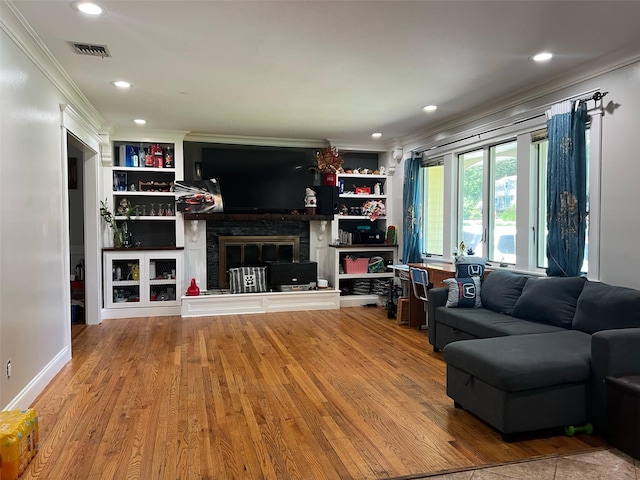 190 Springdale Dr, Ronkonkoma, NY 11779 - living area featuring ornamental molding, a fireplace, wood finished floors, recessed lighting, and built in features