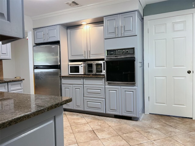 190 Springdale Dr, Ronkonkoma, NY 11779 - kitchen featuring black oven, freestanding refrigerator, gray cabinetry, ornamental molding, and white microwave