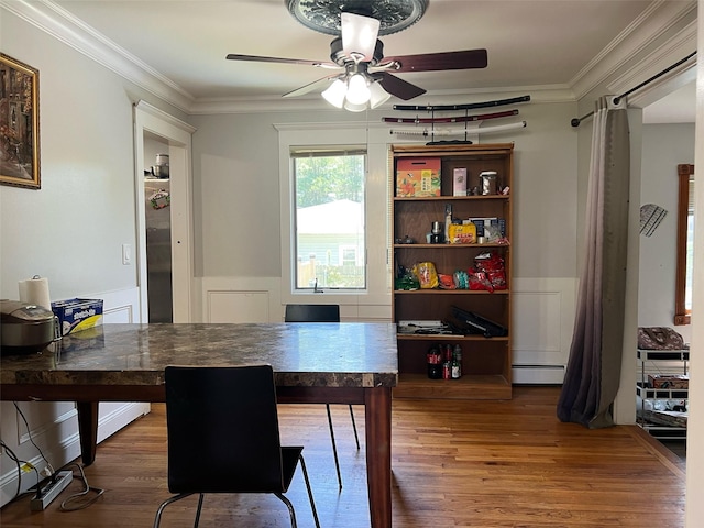 190 Springdale Dr, Ronkonkoma, NY 11779 - dining area with ceiling fan, wood finished floors, crown molding, wainscoting, and baseboard heating