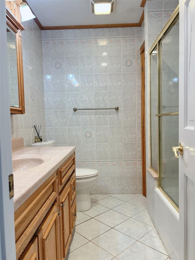 190 Springdale Dr, Ronkonkoma, NY 11779 - bathroom featuring vanity, tile walls, ornamental molding, shower / bath combination with glass door, and tile patterned flooring