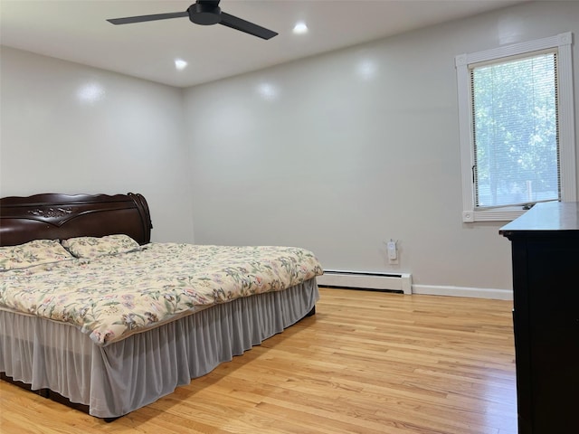 190 Springdale Dr, Ronkonkoma, NY 11779 - bedroom with a baseboard radiator, light wood-type flooring, recessed lighting, and a ceiling fan