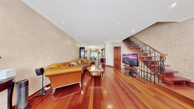 20 Corbin Pl, Brooklyn, NY 11235 - living area featuring wood finished floors, crown molding, wallpapered walls, stairway, and recessed lighting