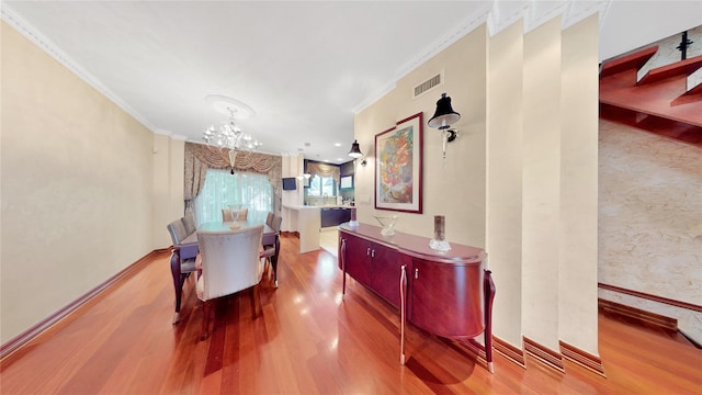 20 Corbin Pl, Brooklyn, NY 11235 - dining space with a chandelier, wood finished floors, crown molding, and wallpapered walls