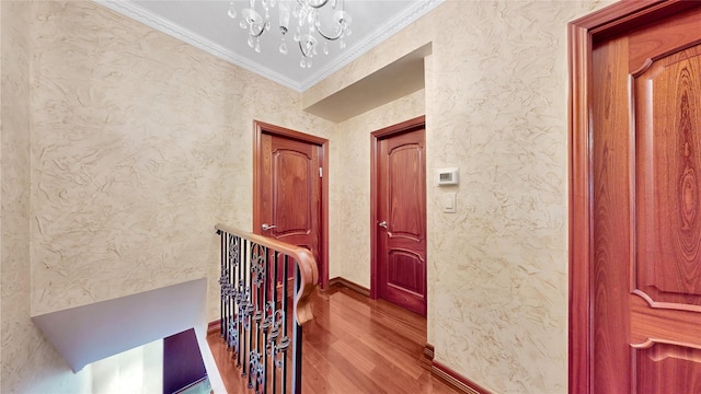 20 Corbin Pl, Brooklyn, NY 11235 - corridor with wood finished floors, crown molding, a chandelier, and an upstairs landing