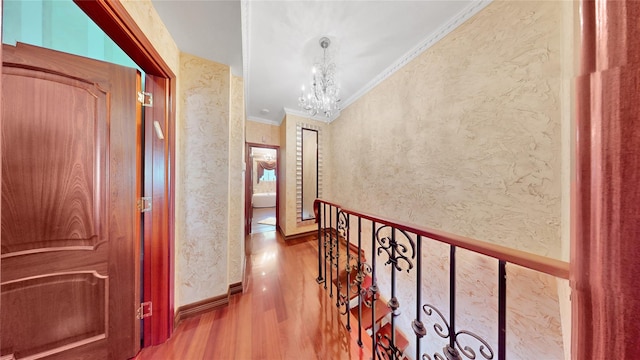 20 Corbin Pl, Brooklyn, NY 11235 - hallway with wood finished floors, crown molding, and a chandelier