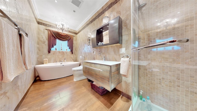 20 Corbin Pl, Brooklyn, NY 11235 - bathroom with ornamental molding, vanity, a shower stall, a soaking tub, and wood finished floors