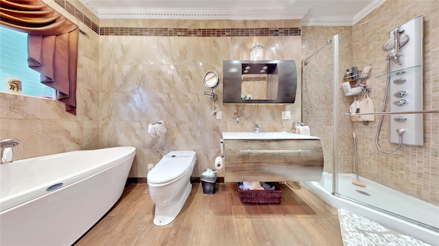 20 Corbin Pl, Brooklyn, NY 11235 - full bath featuring crown molding, tile walls, a stall shower, wood finished floors, and vanity