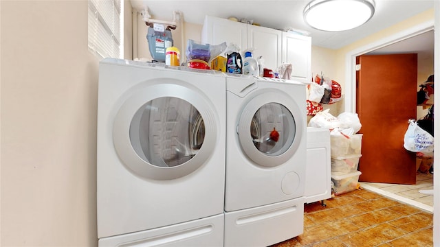 20 Corbin Pl, Brooklyn, NY 11235 - laundry room with independent washer and dryer, cabinet space, and light tile patterned floors