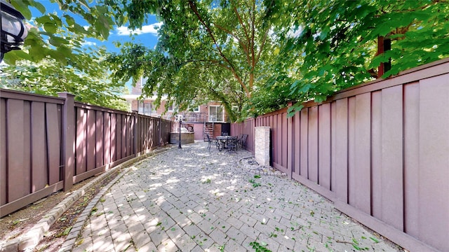 20 Corbin Pl, Brooklyn, NY 11235 - fenced backyard with a patio and outdoor dining area