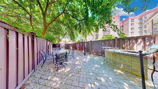 20 Corbin Pl, Brooklyn, NY 11235 - fenced backyard featuring outdoor dining space and a patio area