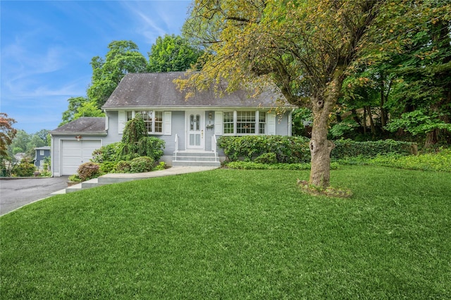 5 Hillaire Pl, Nanuet, NY 10954 - view of front of home with driveway, an attached garage, and a front yard