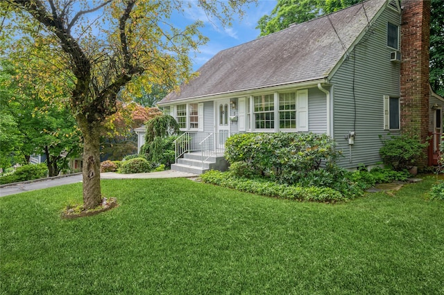 5 Hillaire Pl, Nanuet, NY 10954 - view of front of home with a front yard, roof with shingles, and a chimney