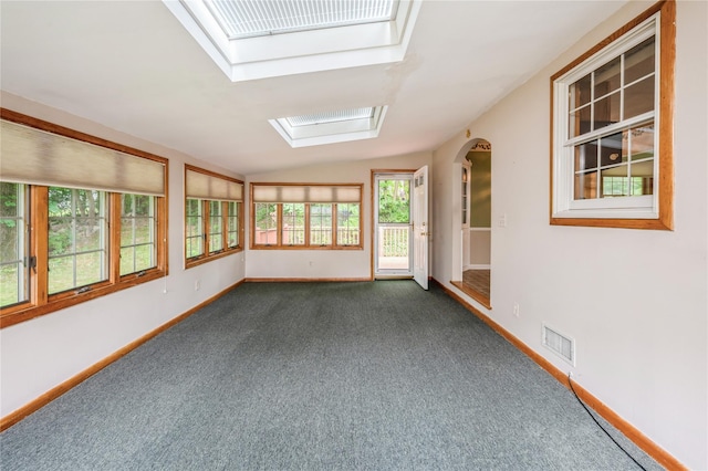 5 Hillaire Pl, Nanuet, NY 10954 - unfurnished sunroom with a skylight, lofted ceiling, carpet floors, and arched walkways