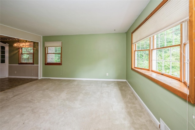 5 Hillaire Pl, Nanuet, NY 10954 - spare room featuring plenty of natural light, carpet flooring, and a chandelier