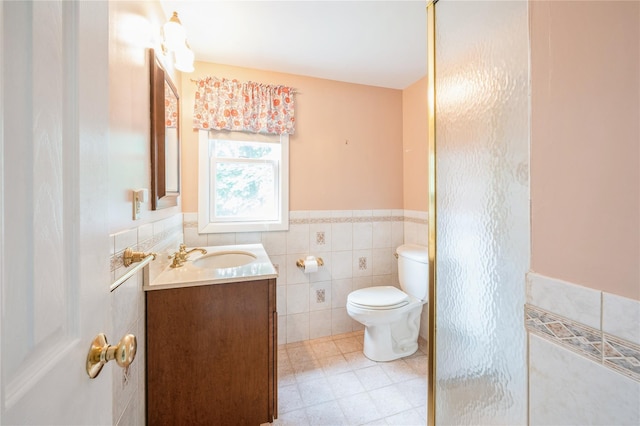 5 Hillaire Pl, Nanuet, NY 10954 - bathroom featuring vanity, tile walls, and a wainscoted wall
