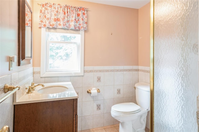 5 Hillaire Pl, Nanuet, NY 10954 - bathroom with vanity, tile walls, wainscoting, and tile patterned flooring