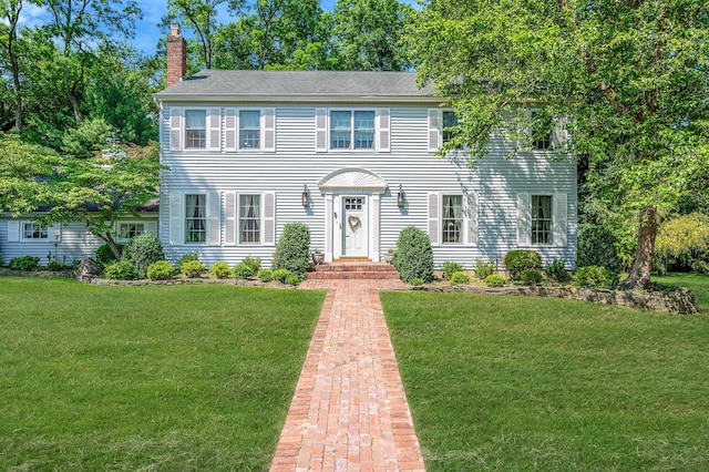 2 Seaview Ln, Mount Sinai, NY 11766 - colonial home with a chimney and a front lawn